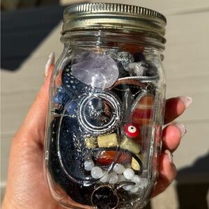 Assorted Jewelry and Crystals in Mason Jar